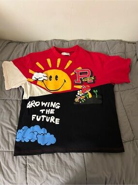 Men’s graphic first row growing the future tee